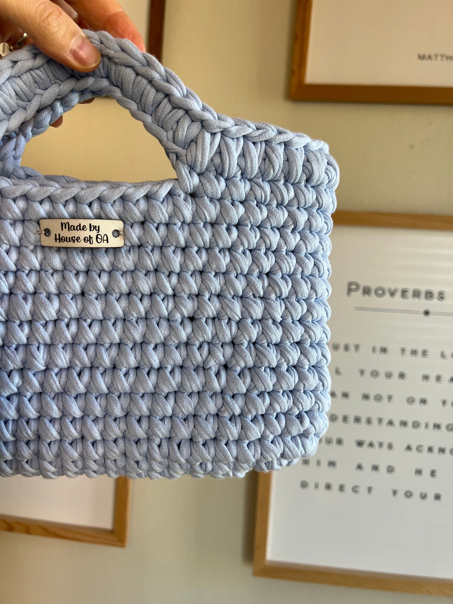 Blue handmade crochet tote clutch bag with bow strap detail