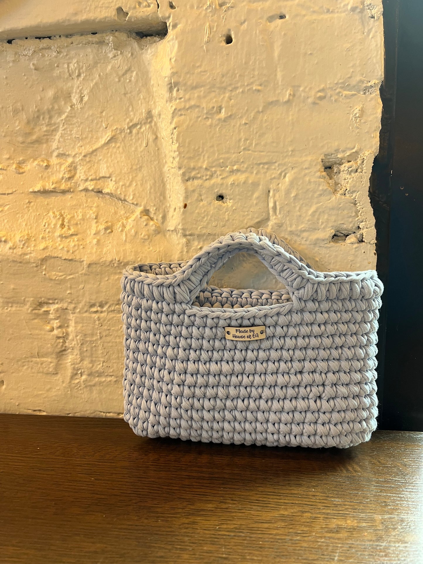 Blue handmade crochet tote clutch bag with bow strap detail