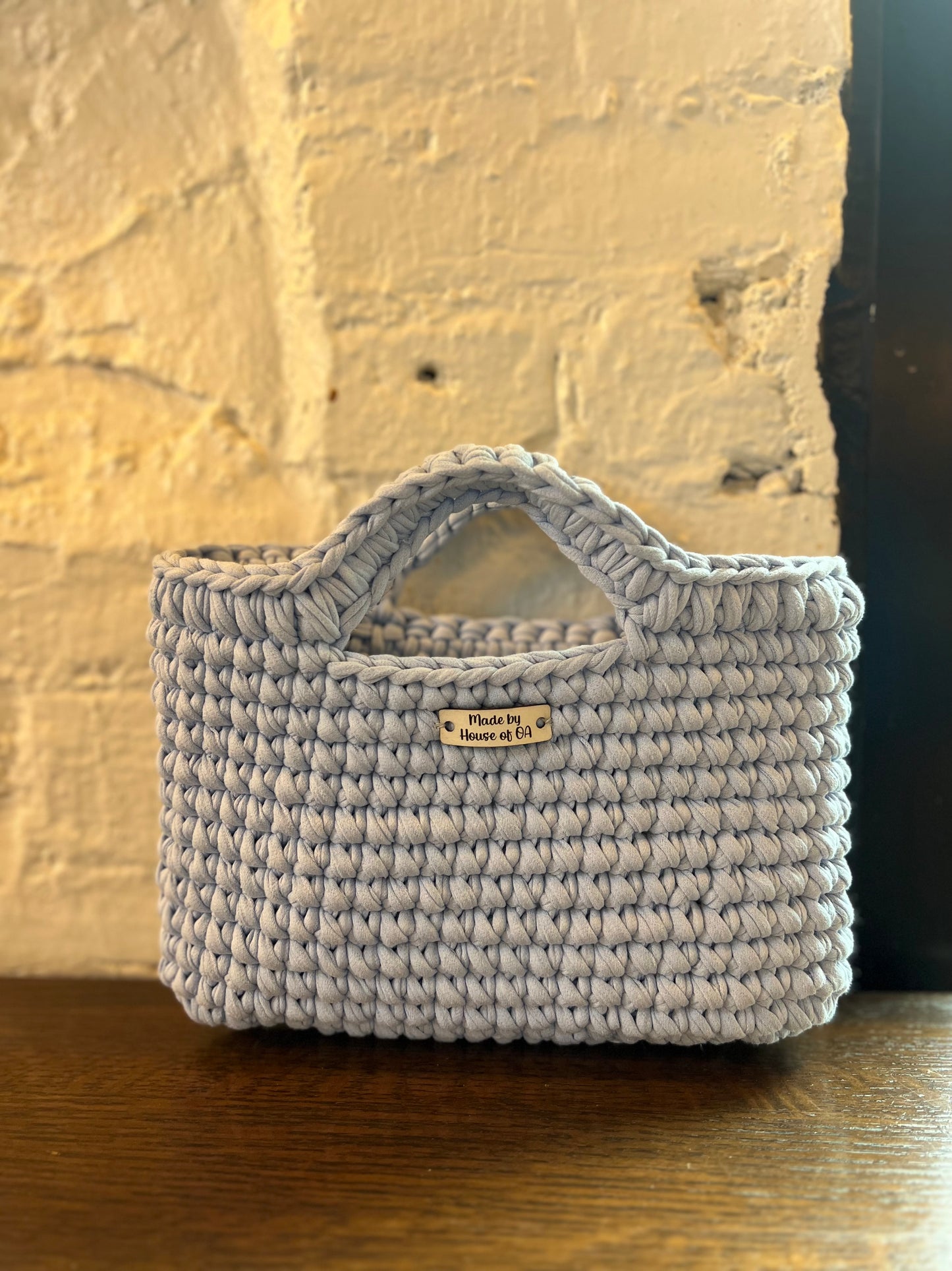 Blue handmade crochet tote clutch bag with bow strap detail