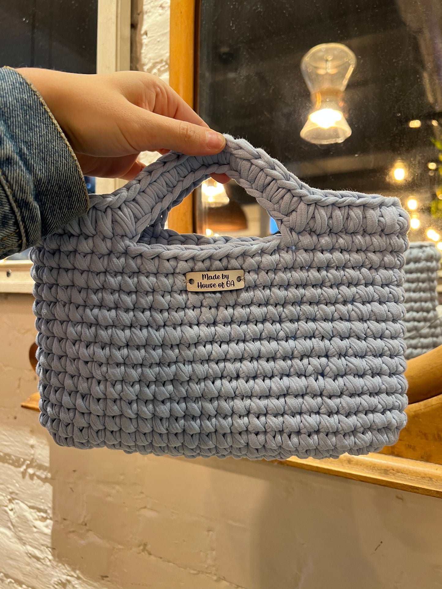 Blue handmade crochet tote clutch bag with bow strap detail