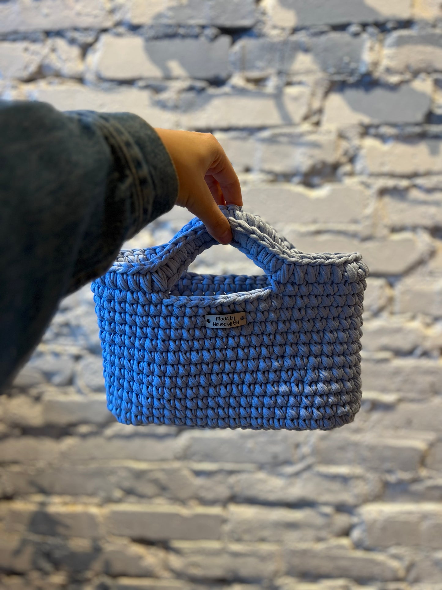 Blue handmade crochet tote clutch bag with bow strap detail